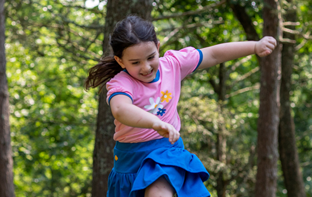 daisy girl scout running outside