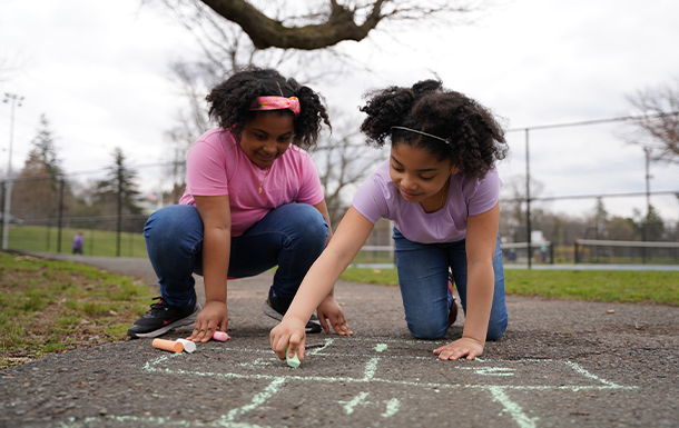 girls playing with chalk