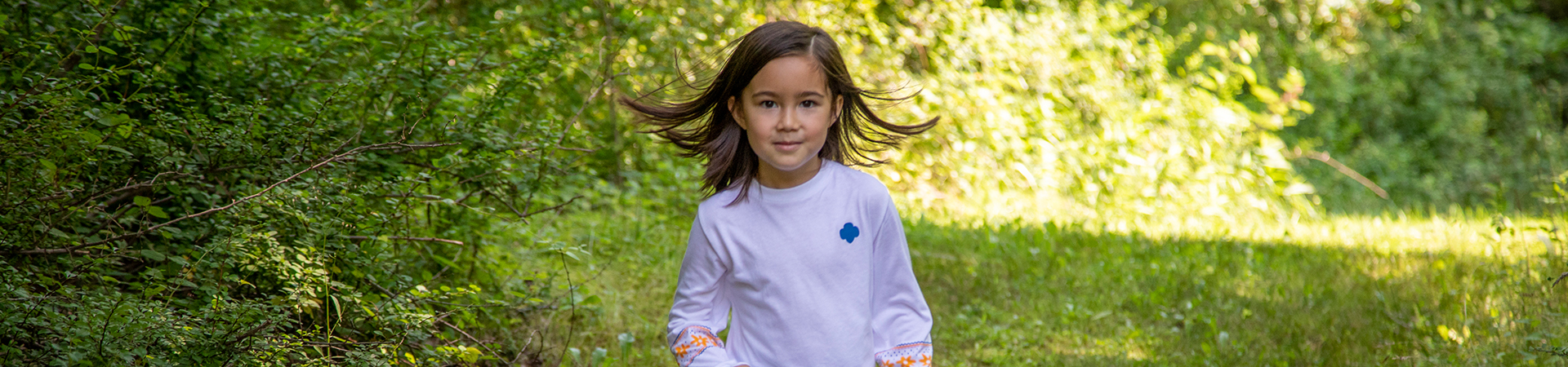  girl scout walking outside 