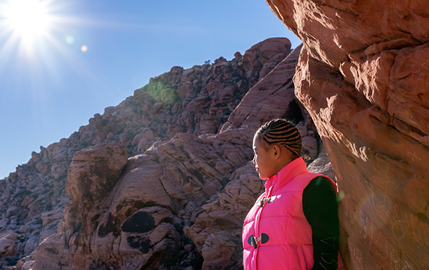 girl scout standing in the desert mountains